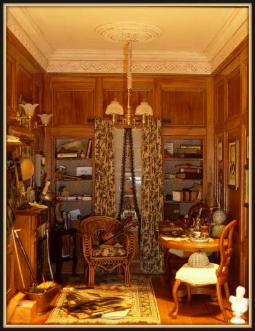 Sherlock Holmes - This is a hand crafted room box depicting Mary's interpretation of the Sherlock Holmes room primarily from the BBC series.  There is a four page document which points out all the special objects in the room from different stories.
