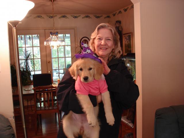 Mom holds her granddoggy "Chloe" at Halloween