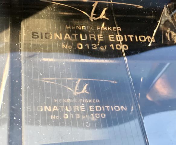 Console signature of Henrik Fisker, designer of car and founder of Fisker Automotive. This is Signature Edition  Car #13 of only 100 Fisker Karma Signature Edition Cars 1 thru 100.