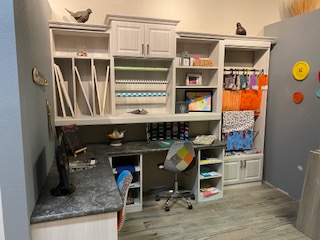 Custom craft room with 2 knee spaces for sewing or crafting storage and display areas for all your crafting needs.