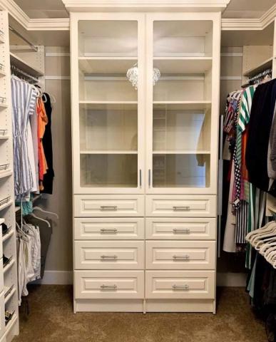 Closet Antique White 2 tall 2 drawer units with Glass doors and open shelving inside.