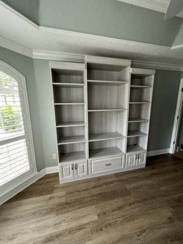Beautiful Large Book case with crown molding and lower drawers for storage.