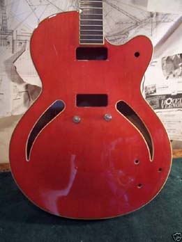 "Before".  I bought this damaged husk.  The fretboard was chemically damaged and needed replaced.  The bout had been gutted.  I had an idea of what I wanted to do with it, but had to learn each step as I went.