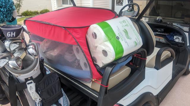 Walmart dog crate serves other purposes on golf cart