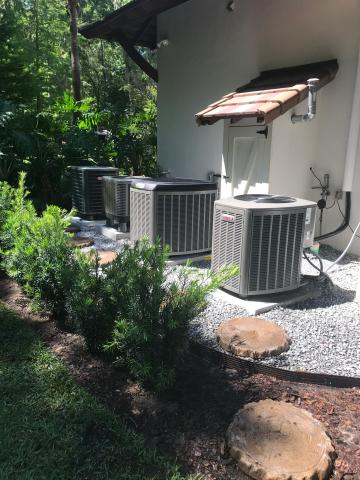 Landscaping decor around these Lennox condensers
