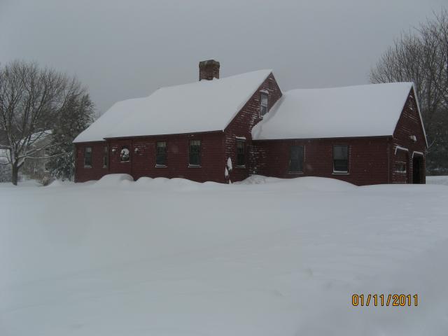 Home buried in snow