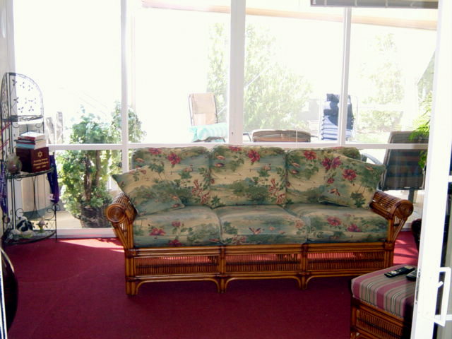 INSIDE ENCLOSED LANAI LEADING OUT TO BIRDGCAGE