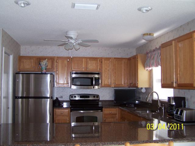 New Kitchen March 2011. We DID change out that brass light fixture to a brushed nickel one! Looks much better!