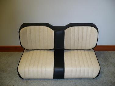 Beige long wingback Precedent with black sides, center and trim.