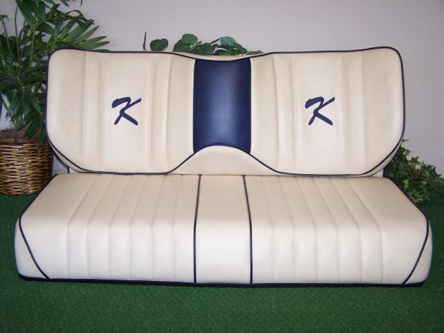 White long wingback with blue center and trim and "K" embroidery.