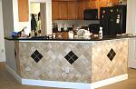 Tile backsplash under kitchen bar