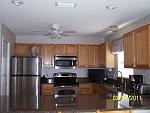 New Kitchen March 2011. We DID change out that brass light fixture to a brushed nickel one! Looks much better!