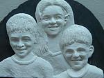 A challenge to do a 3D low relief portrait of a friend's three grandchildren in clay - 18 x 15 ins. Mounted on a large slab of dark grey slate. ...