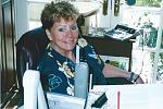 Susan in her home office overlooking the ocean